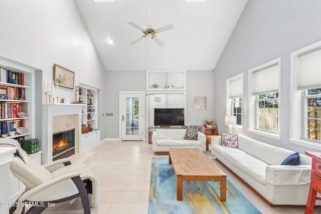 living room with a wealth of natural light, high vaulted ceiling, and light tile patterned floors