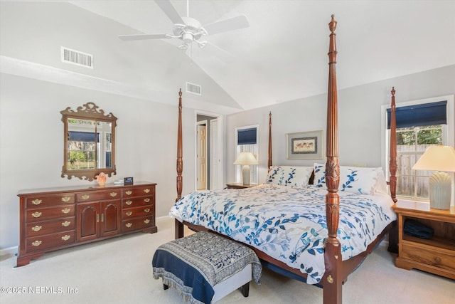 bedroom featuring lofted ceiling, light colored carpet, and ceiling fan