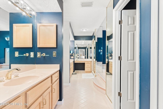 bathroom featuring vanity and tile patterned floors