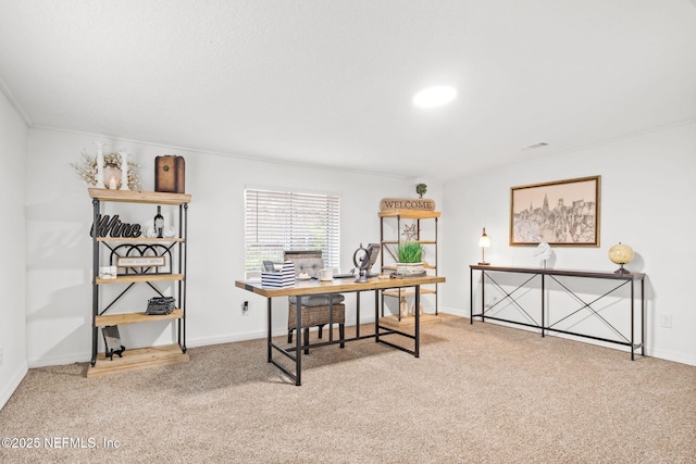 carpeted office featuring baseboards