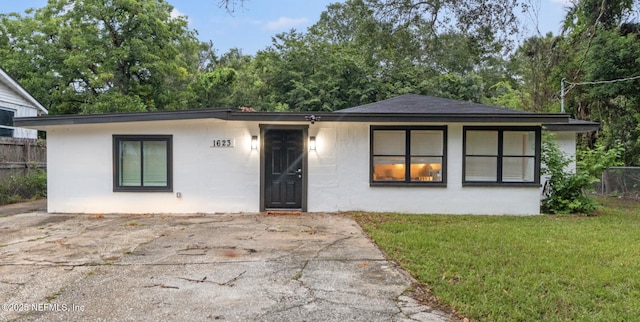 1623 Saint Clair St, Jacksonville, FL 32254 - view of front of home with a front yard and fence