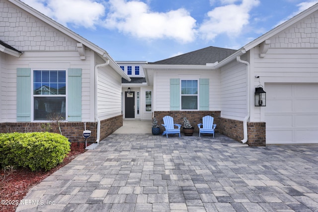 doorway to property featuring a garage