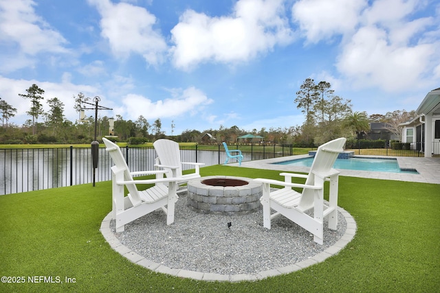 view of patio featuring a fenced in pool, a fire pit, and a water view