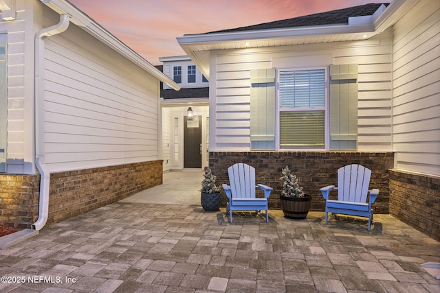 view of patio terrace at dusk