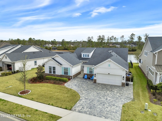 view of front of property featuring a garage and a front lawn