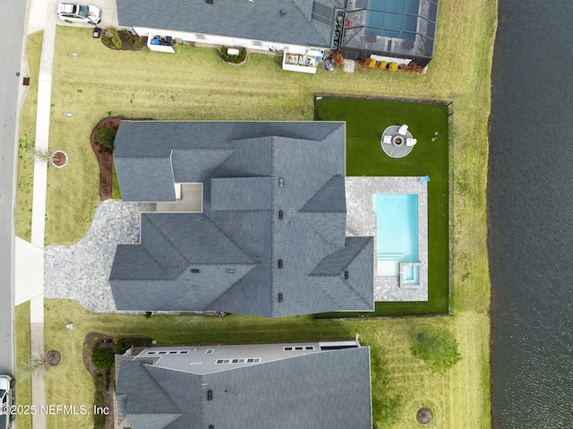 drone / aerial view with a water view