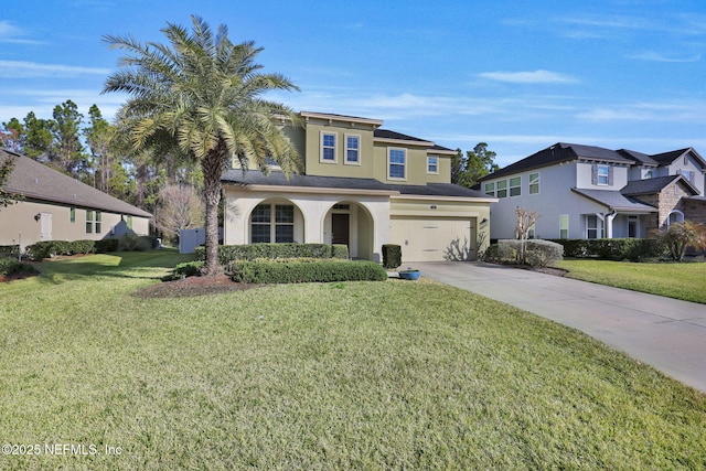 view of front facade with a garage and a front lawn