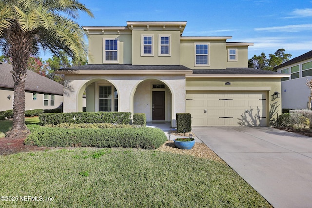 view of front facade featuring a garage and a front lawn