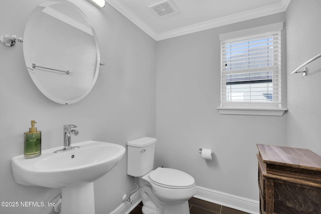 bathroom with hardwood / wood-style flooring, ornamental molding, and toilet