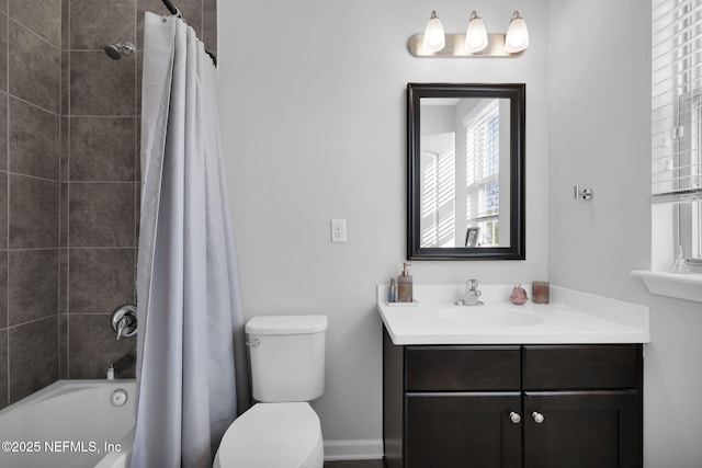 full bathroom featuring vanity, toilet, and shower / tub combo