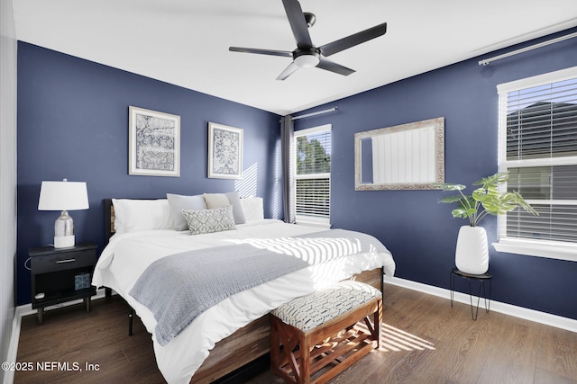 bedroom featuring dark hardwood / wood-style flooring and ceiling fan