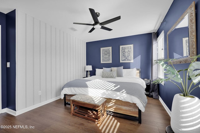 bedroom featuring dark wood-type flooring and ceiling fan