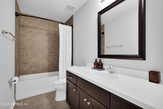 full bathroom featuring vanity, shower / bath combo, tile patterned floors, and toilet