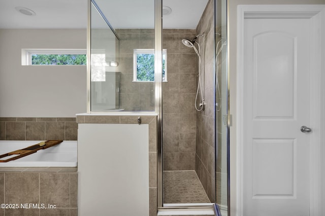 bathroom with independent shower and bath