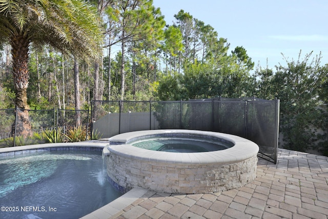 view of swimming pool featuring an in ground hot tub