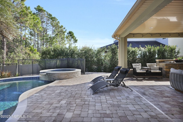 view of patio / terrace with an outdoor hangout area and a pool with hot tub