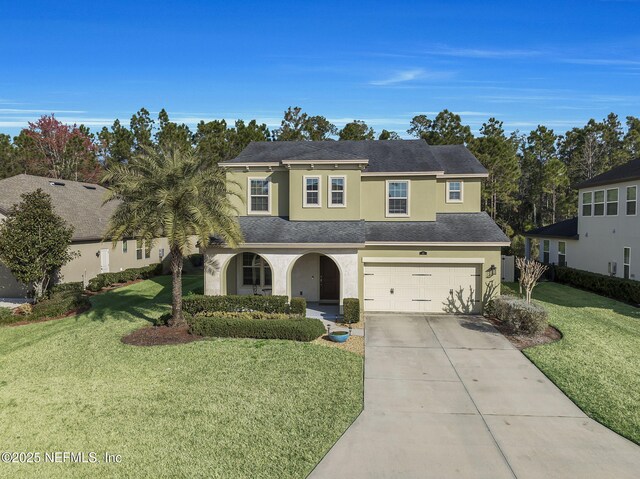 view of front of home with a garage and a front yard