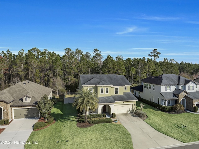 view of front facade featuring a garage and a front yard