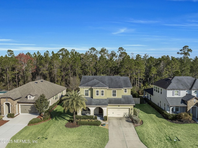 view of front of home with a garage and a front lawn