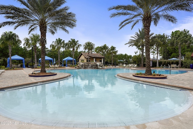 view of swimming pool with a gazebo and a patio area