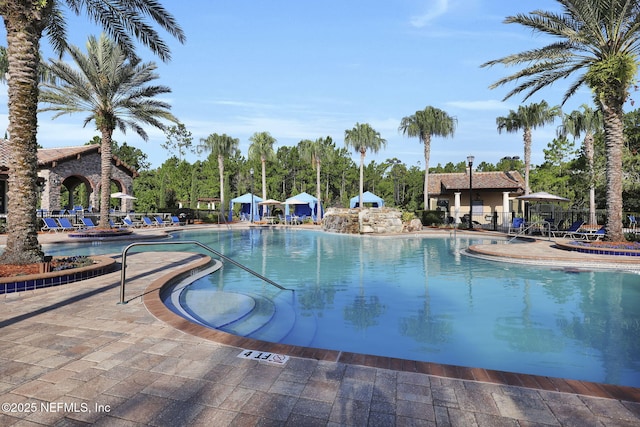 view of swimming pool featuring a patio area