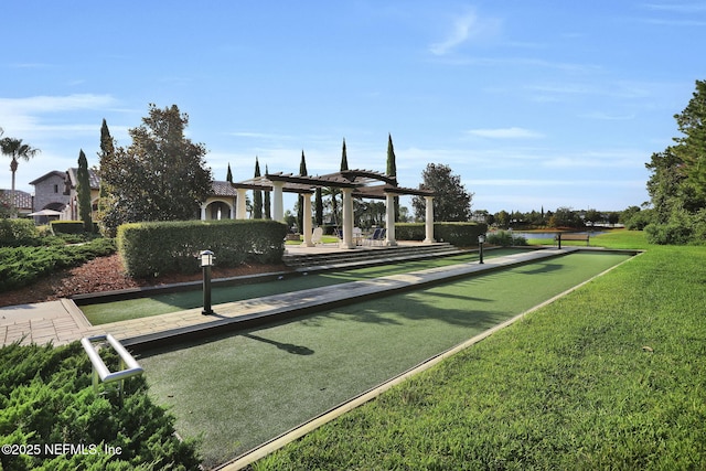 view of community with a pergola and a lawn