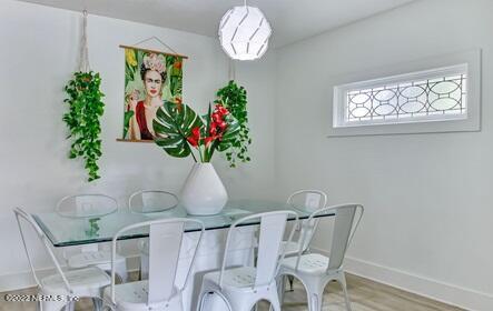 dining space featuring hardwood / wood-style flooring