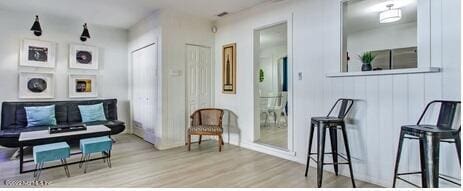 sitting room featuring light hardwood / wood-style flooring