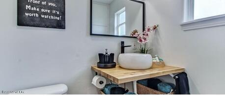 bathroom featuring toilet and sink