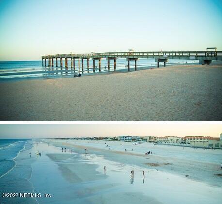 dock area with a beach view and a water view