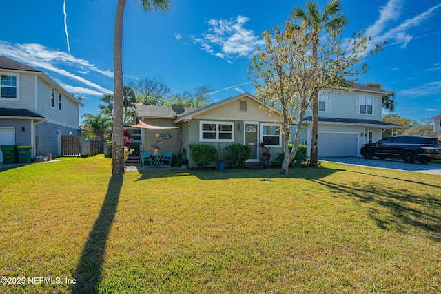 view of front facade featuring a garage and a front yard