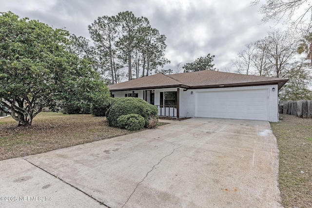 ranch-style home featuring a garage