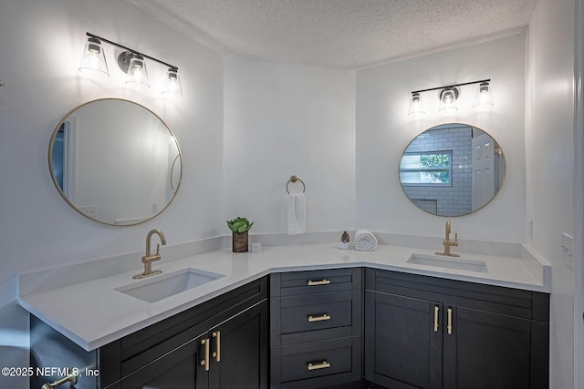 bathroom featuring vanity and a textured ceiling