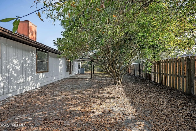 view of yard with central air condition unit