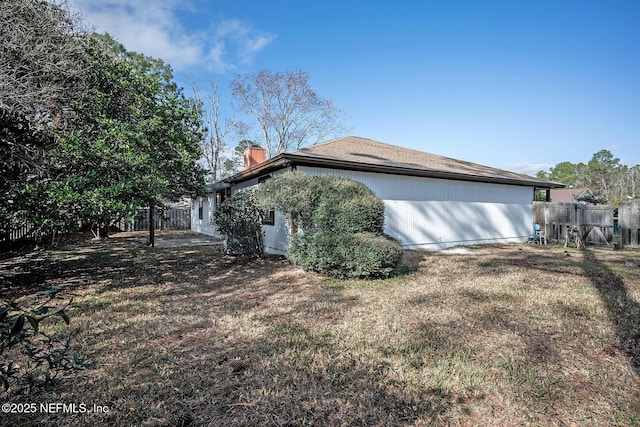 view of property exterior featuring a yard