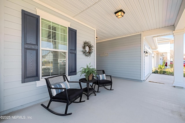 view of patio featuring a porch