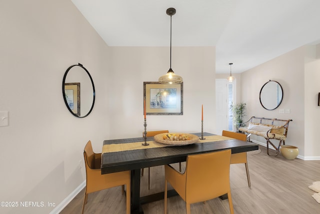 dining room featuring breakfast area and light hardwood / wood-style flooring