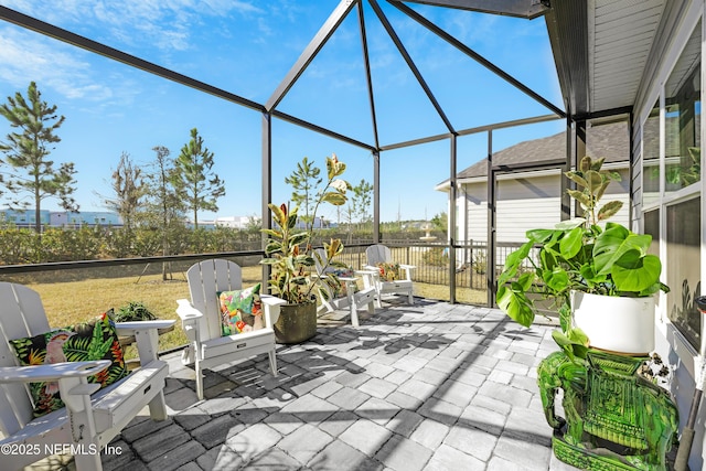 view of patio / terrace featuring a lanai