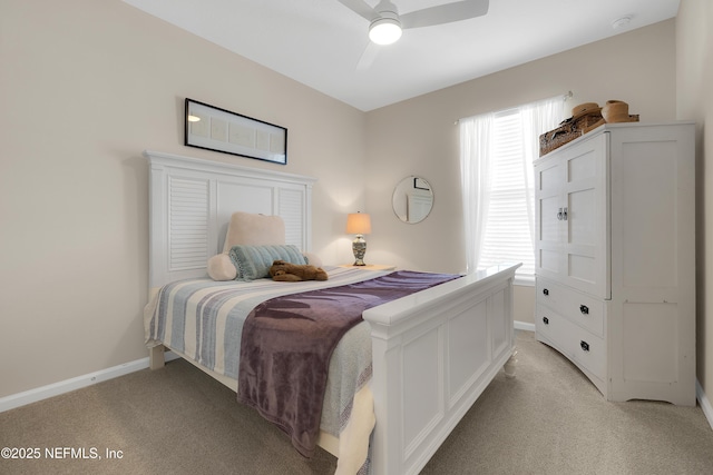 bedroom featuring light colored carpet and ceiling fan