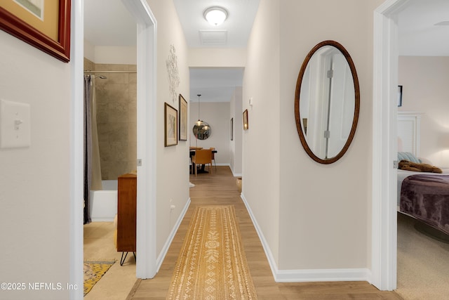 hallway featuring light wood-type flooring