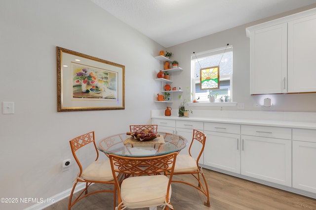 dining area with light wood-type flooring