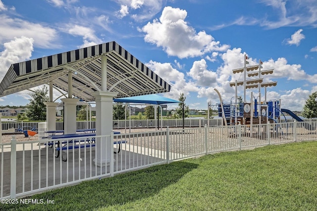 view of swimming pool featuring a yard and a playground