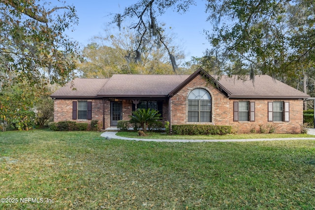 ranch-style home with a front lawn