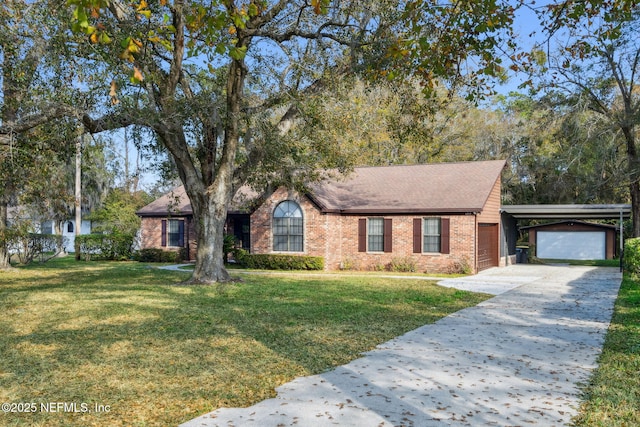 view of front of property with a garage, a front yard, and a carport