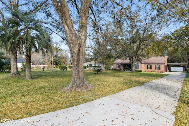 exterior space featuring a garage and a front lawn