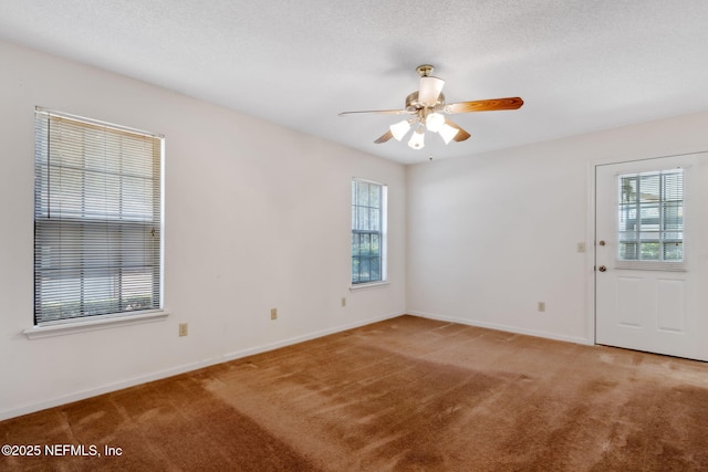 unfurnished room with carpet floors, a textured ceiling, and ceiling fan