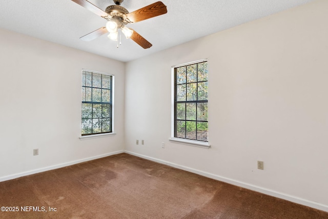 empty room featuring a textured ceiling, ceiling fan, and carpet flooring