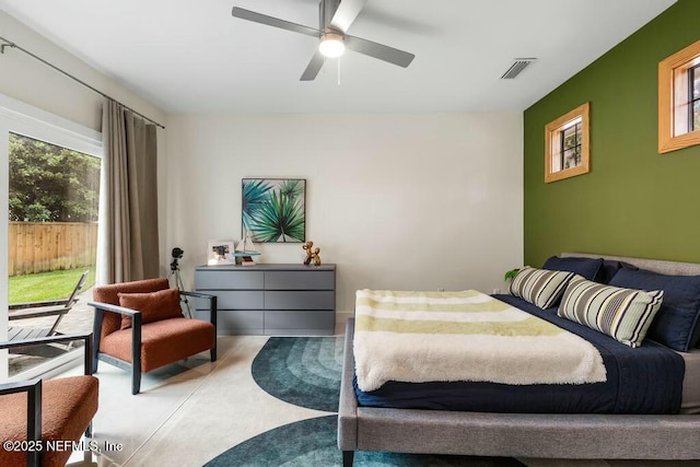 bedroom featuring access to exterior, visible vents, and a ceiling fan