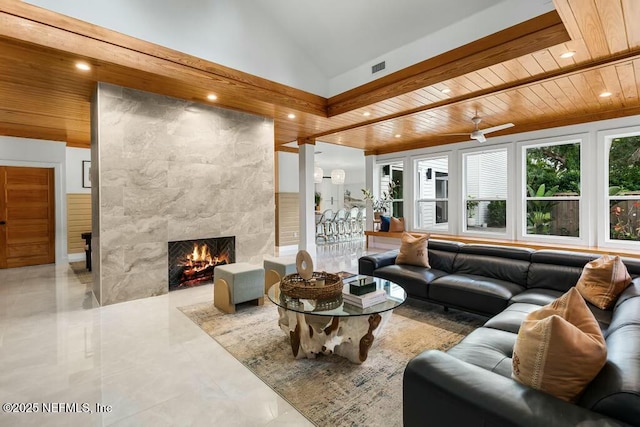 living room with wooden ceiling, visible vents, and a high end fireplace