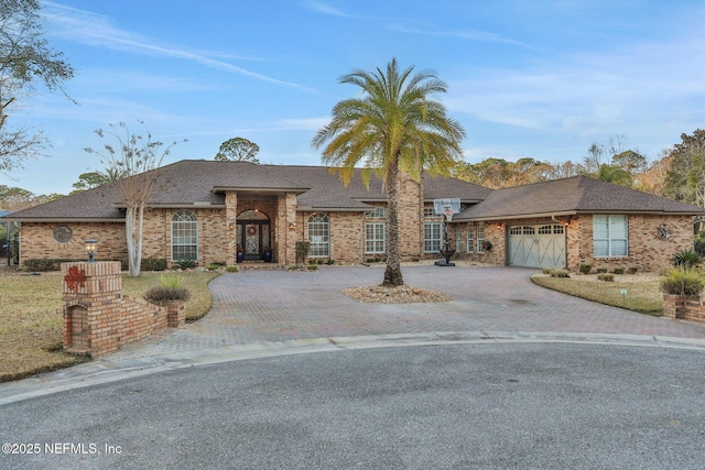 ranch-style house featuring a garage